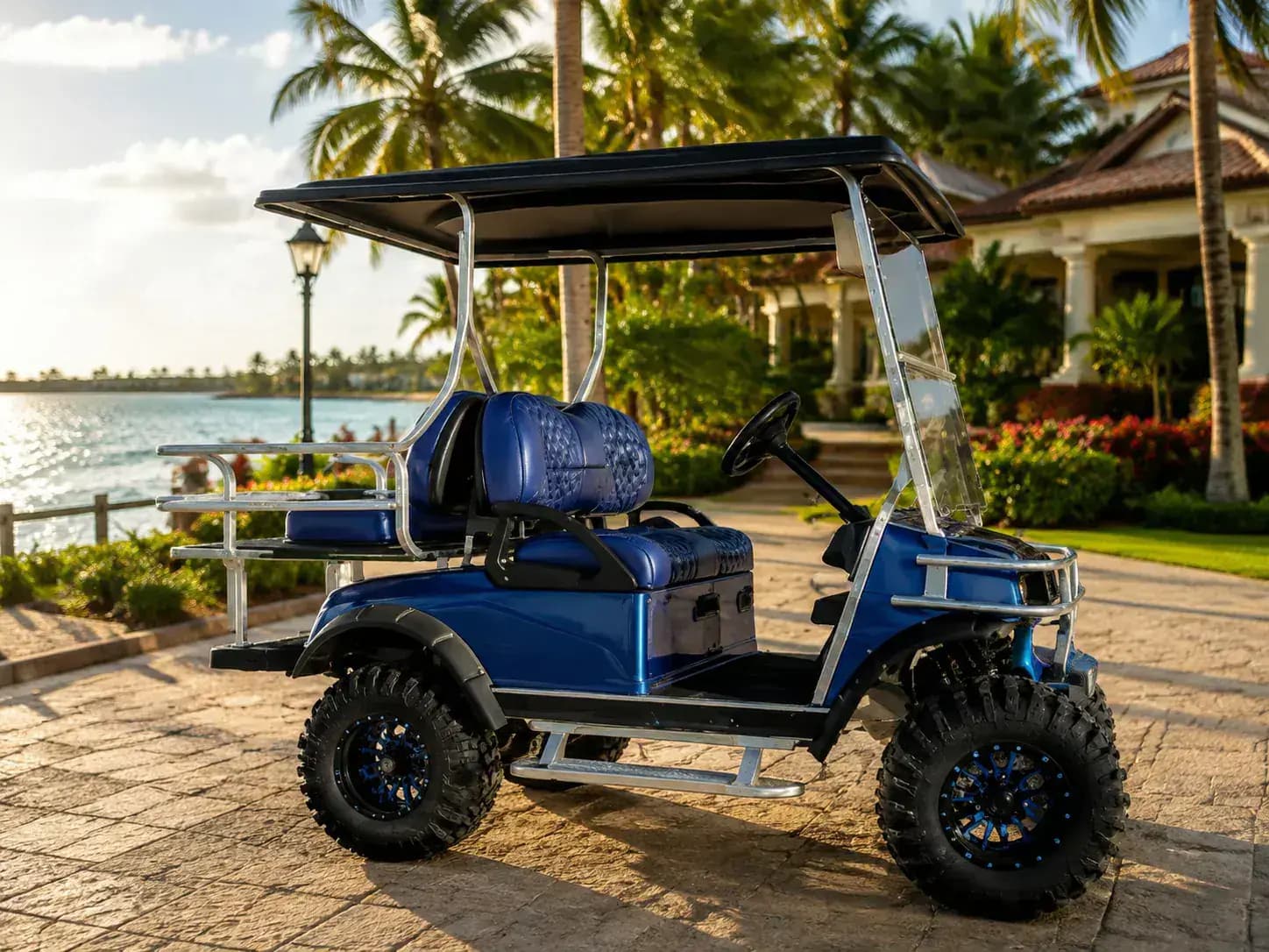 Four-seater golf cart parked at a tropical resort in San Pedro